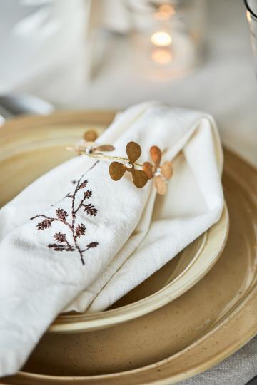 Servettring, Mässingblomma